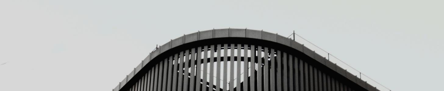 Curved roofline of a Gencore project against the sky